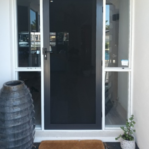 Crimsafe Classic hinged door installed by Davcon in colour Monument