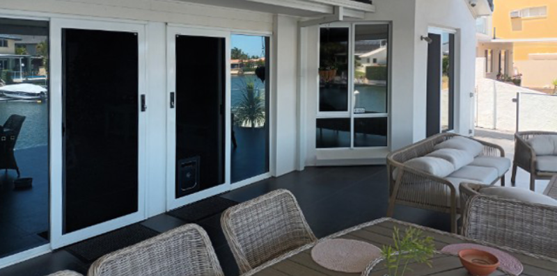 Crimsafe Classic window and Crimsafe Classic sliding door installed by Davcon in colour Monument