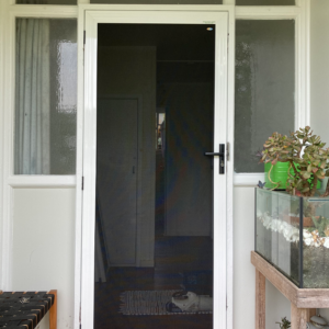 Crimsafe regular hinged door in Pearl White installed by Davcon
