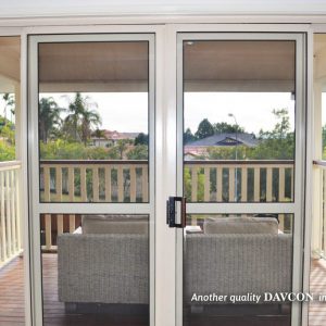 Sliding crimsafe security doors leading onto back patio Sliding crimsafe security doors leading onto back patio