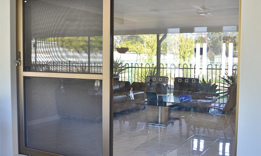 crimsafe security screens installed on back doors to outdoor living area