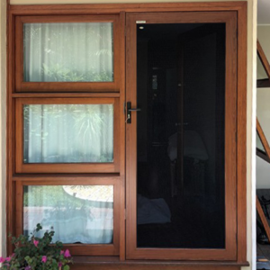 Crimsafe Ultimate hinged door in Bush Cherry wood finish installed by Davcon