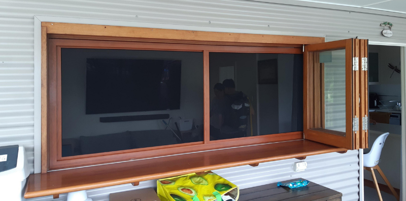 Crimsafe windows in Red Cedar