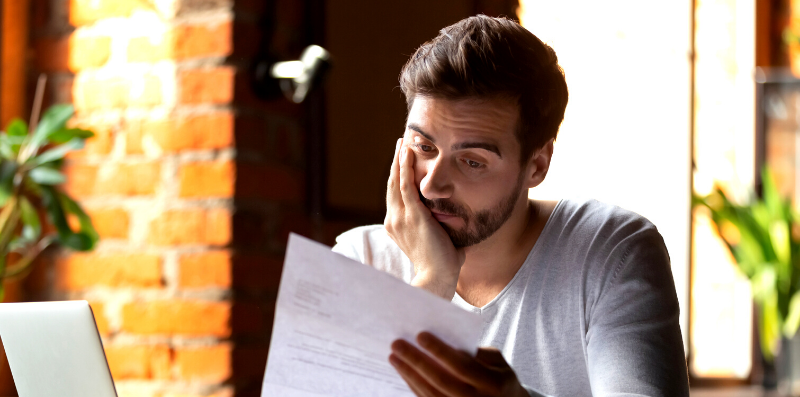 Man looking at Crimsafe quotes trying to find the difference